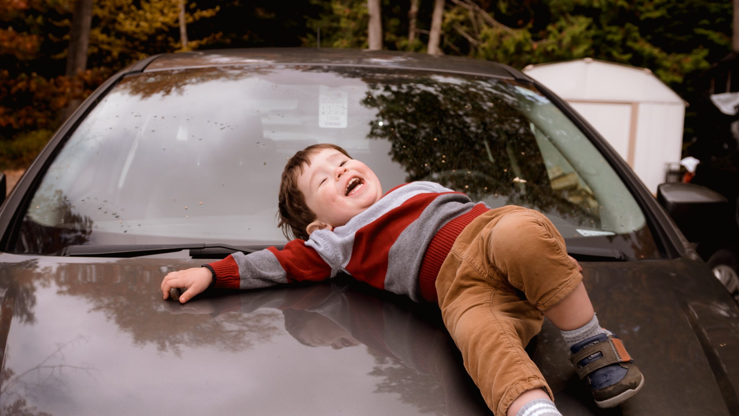 photo-of-boy-lying-down-on-car-hood-3204087