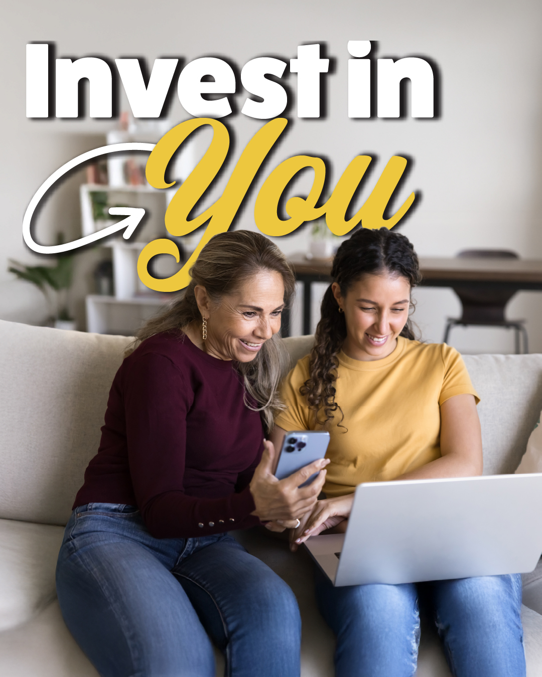 Two women smiling while looking at a laptop and phone on a cozy living room couch. Text above reads "Invest in You," suggesting self-improvement.