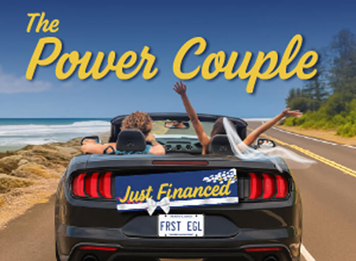 Sports car with Just Financed license plate and couple in front seats