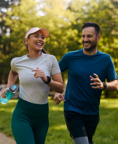 Two men jogging together in park