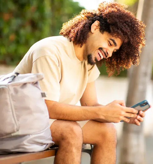 Man sitting relaxed using smartphone