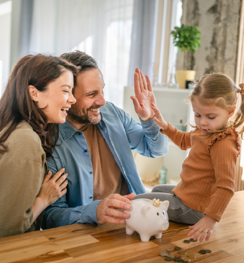 Family saving money with child piggy bank