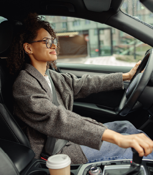 Woman driving car interior view