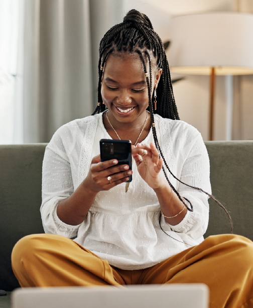 Woman sitting and using smartphone