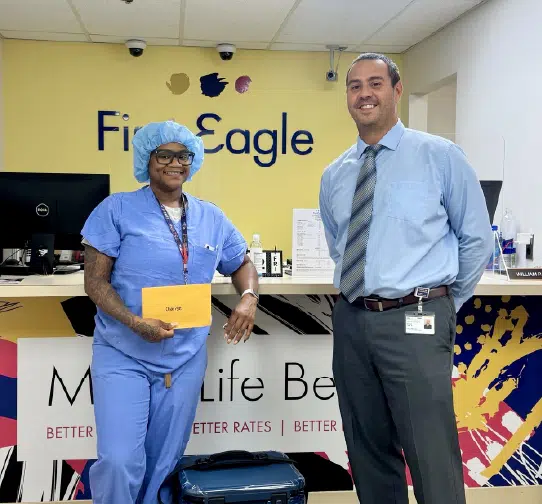 Healthcare workers standing in bank lobby