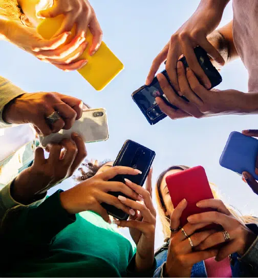 Hands holding multiple smartphones together