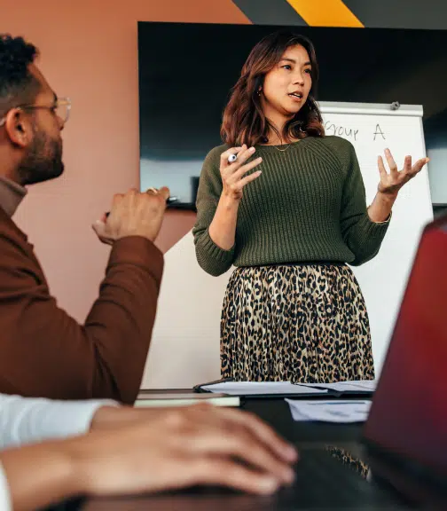 Woman presenting during small team meeting