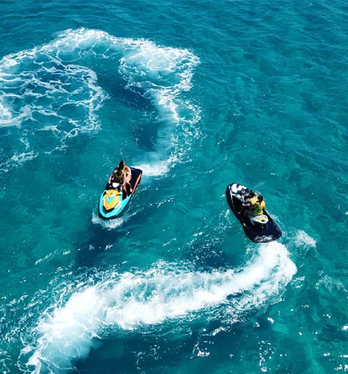 Aerial view of people surfing in ocean