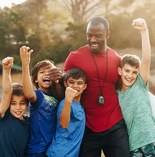 Coach with a group of small boys