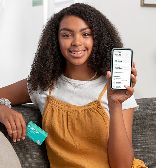 Woman holding smartphone and smiling
